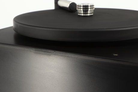 Close up of a used Okki Nokki One Record Cleaning Machine in a black finish showing some marks on casework