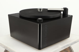 Front left corner of a used Okki Nokki One Record Cleaning Machine in a black finish