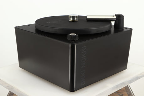Front left corner of a used Okki Nokki One Record Cleaning Machine in a black finish