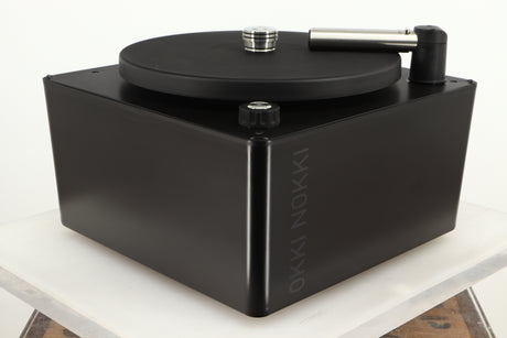 Front left corner of a used Okki Nokki One Record Cleaning Machine in a black finish