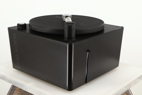 Front right corner of a used Okki Nokki One Record Cleaning Machine in a black finish