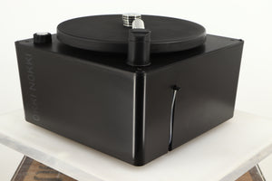 Front right corner of a used Okki Nokki One Record Cleaning Machine in a black finish