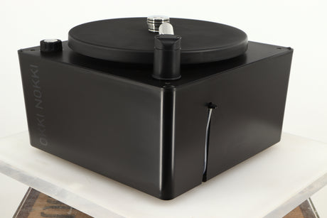 Front right corner of a used Okki Nokki One Record Cleaning Machine in a black finish