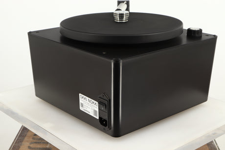 Rear left corner of a used Okki Nokki One Record Cleaning Machine in a black finish