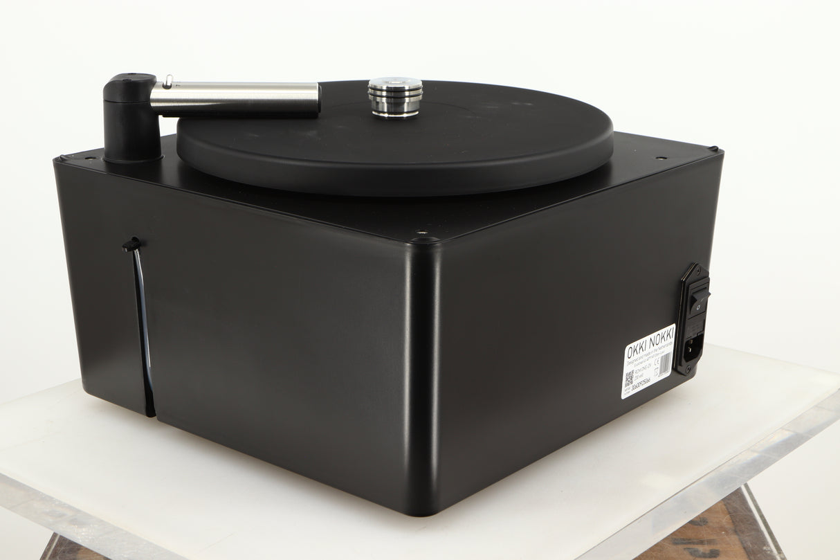 Rear right corner of a used Okki Nokki One Record Cleaning Machine in a black finish