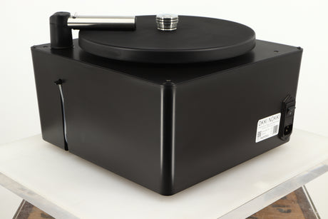 Rear right corner of a used Okki Nokki One Record Cleaning Machine in a black finish