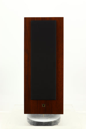Front view of a used Omega Super 3XRS Floorstanding Speaker in a walnut finish showing Grille 