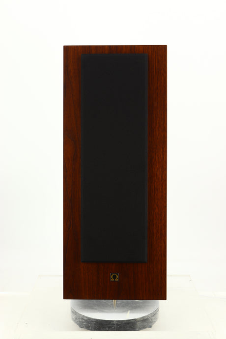 Front view of a used Omega Super 3XRS Floorstanding Speaker in a walnut finish showing Grille 