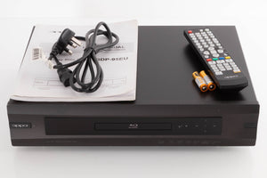 Top of a used Oppo BDP-95EU Blu-Ray Player in a Black finish showing Mains Cable, Manual, Remote and Batteries