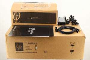 Boxes of a used Origin Live Calypso Mk5 Turntable with Encounter MK5 Tonearm showing manual, mains cable, and tonearm cable