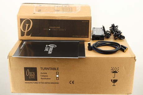 Boxes of a used Origin Live Calypso Mk5 Turntable with Encounter MK5 Tonearm showing manual, mains cable, and tonearm cable
