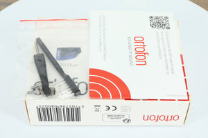 Box of a used Ortofon 2M Blue MM Cartridge showing a manual, brush, screwdriver and 4x bolts