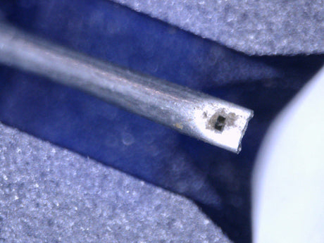 Close up of a used Ortofon 2M Blue MM Cartridge showing the stylus