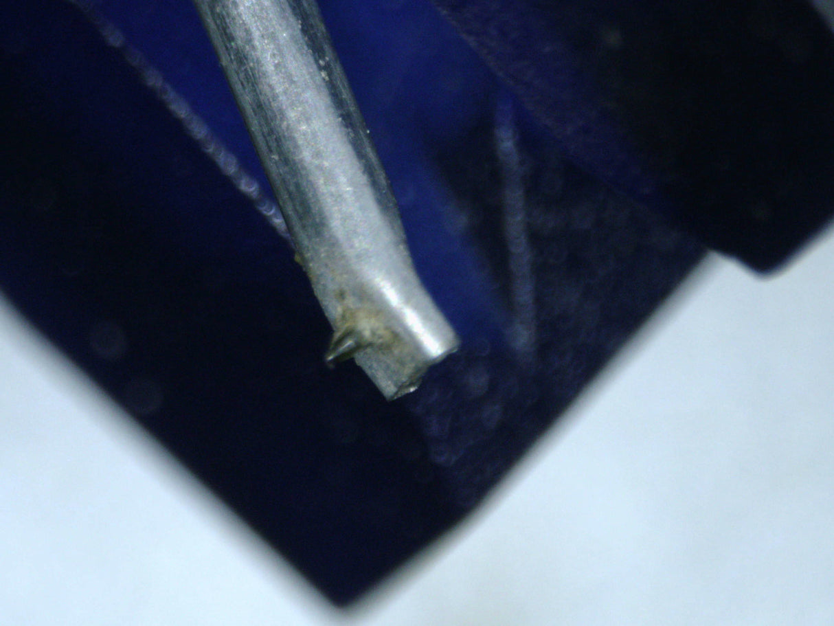 Close up of a used Ortofon 2M Blue MM Cartridge showing the stylus