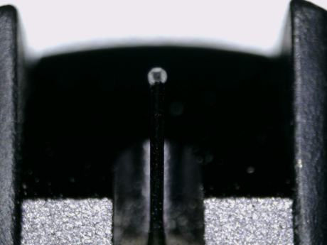 Close up of a used Ortofon Cadenza MC Cartridge in a black finish showing stylus