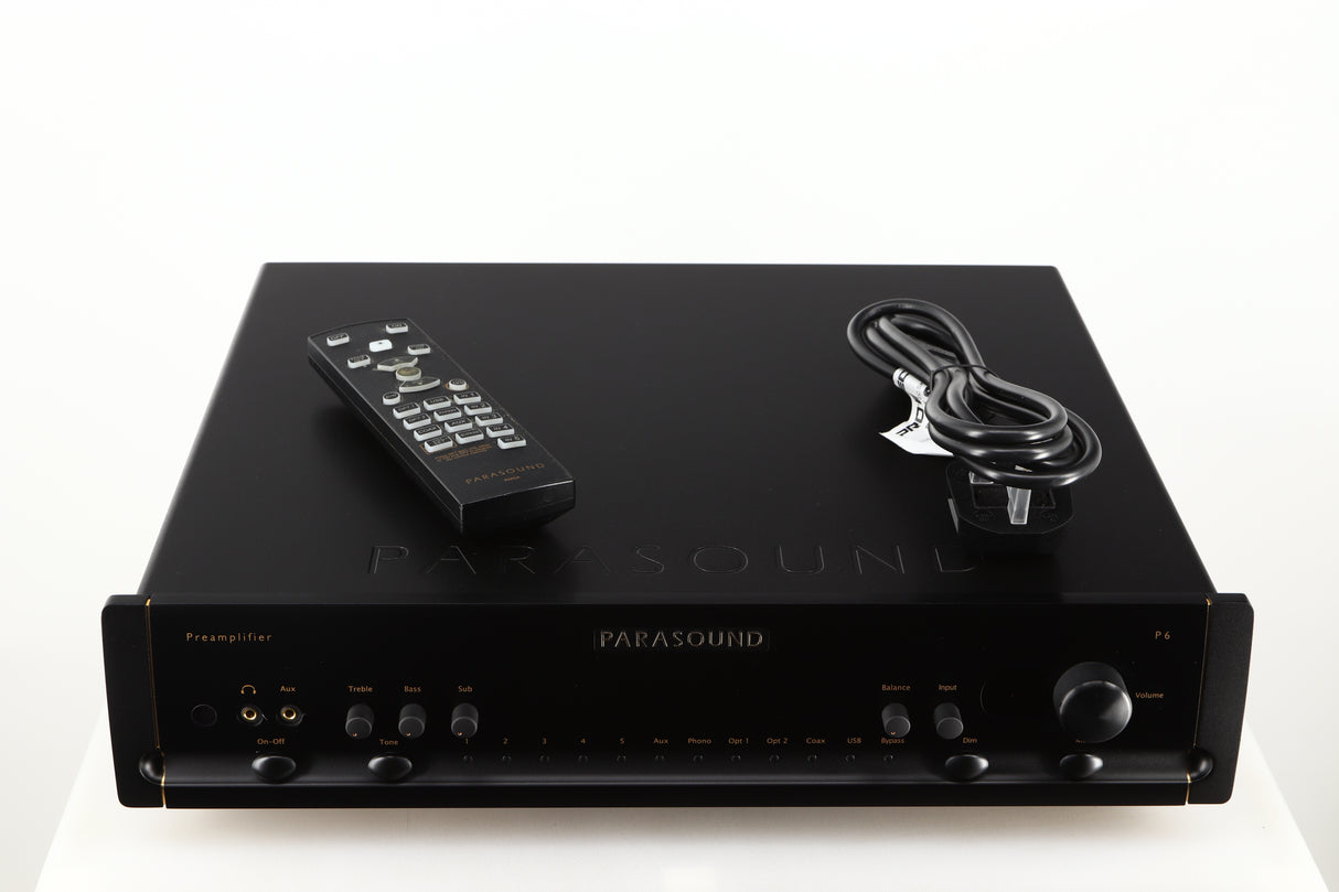 Top of a used Parasound Halo P6 Pre Amplifier in a black finish showing Remote and Mains Cable