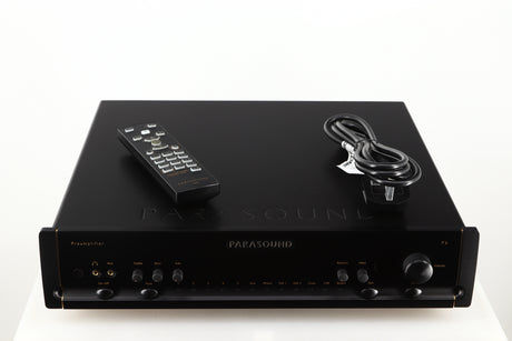 Top of a used Parasound Halo P6 Pre Amplifier in a black finish showing Remote and Mains Cable