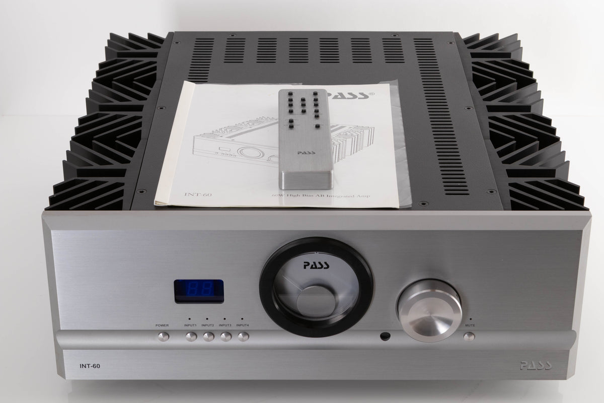 Front view of a used PASS Labs INT-60 Integrated Amplifier in Silver with manual, and remote