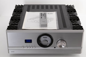 Front view of a used PASS Labs INT-60 Integrated Amplifier in Silver with manual, and remote