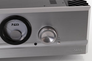 Close up view of a used PASS Labs INT-60 Integrated Amplifier in Silver