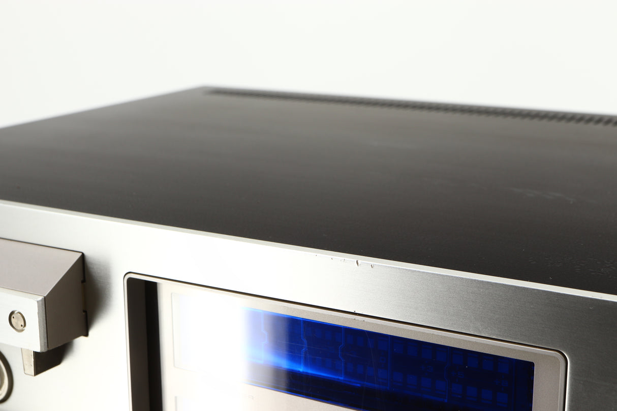Close up of a used Pioneer CT-F1250 Cassette Deck in a silver finish showing some scratches on fascia edge