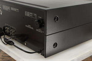 Rear left corner of a used Pioneer CT-F1250 Cassette Deck in a silver finish
