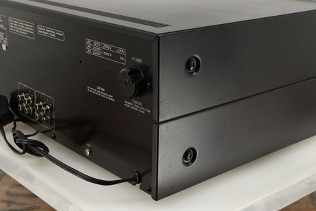 Rear left corner of a used Pioneer CT-F1250 Cassette Deck in a silver finish