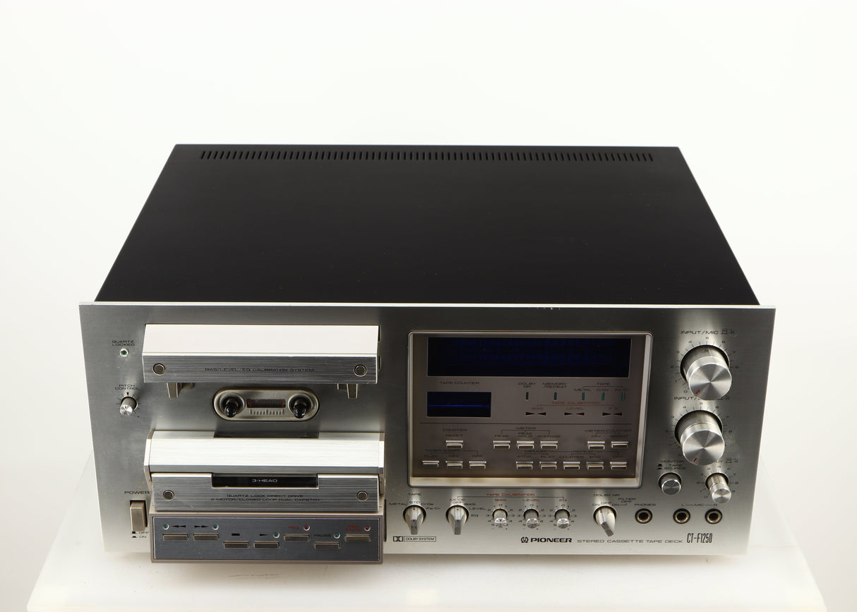 Top of a used Pioneer CT-F1250 Cassette Deck in a silver finish
