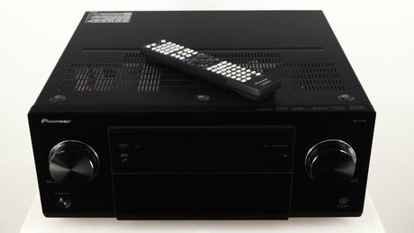 Top of a used Pioneer SC-LX75 AV Receiver in a black finish showing Remote