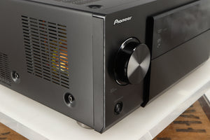 Front left corner of a used Pioneer SC-LX75 AV Receiver in a black finish