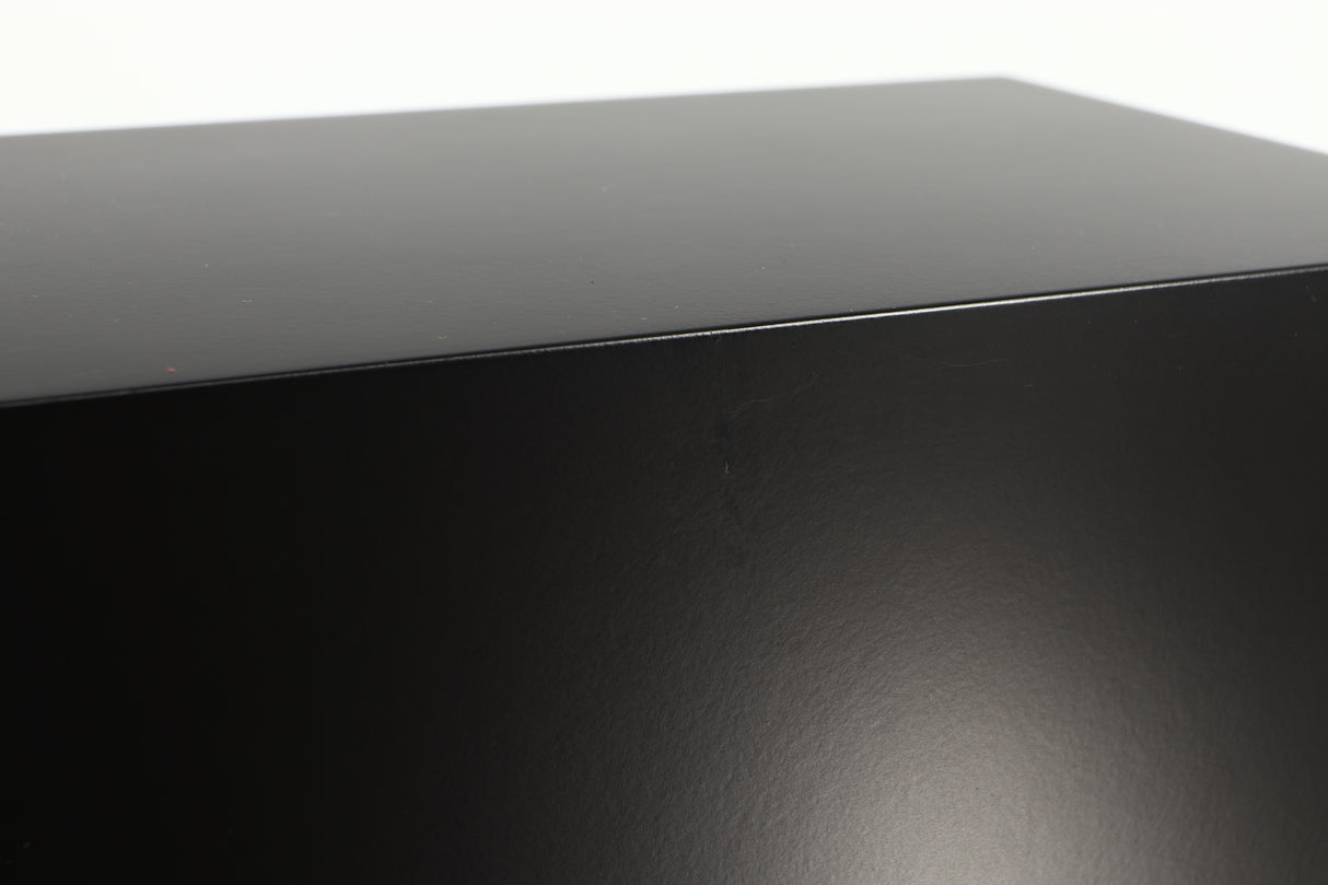 Close up of a used PMC DB1 Gold Standmount Speaker in a black finish showing small blemish on right side