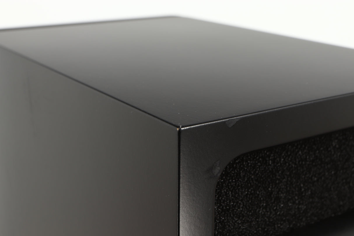 Close up of a used PMC DB1 Gold Standmount Speaker in a black finish showing small blemishes on rear