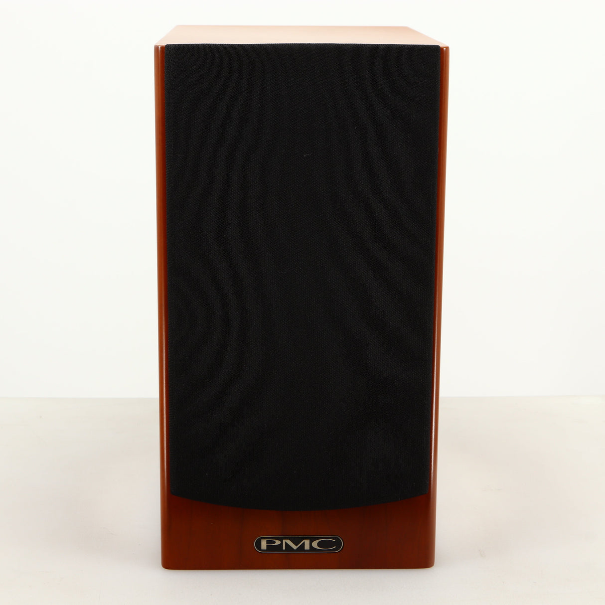 Front view of a used PMC DB1i Standmount Speaker in a cherry finish showing Grille