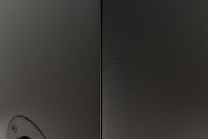 Close up of a used PMC Prodigy 1 Standmount Speakers in a black finish showing some scratching