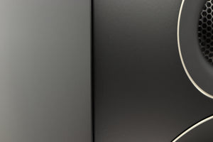 Close up of a used PMC Prodigy 1 Standmount Speakers in a black finish showing some scratching