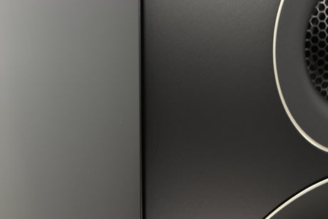 Close up of a used PMC Prodigy 1 Standmount Speakers in a black finish showing some scratching