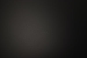 Close up of a used PMC Prodigy 1 Standmount Speaker in a black finish showing light scratch on right side 
