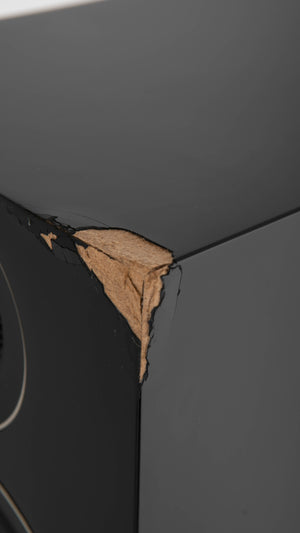 Close up of a used PMC Prodigy5 Floorstanding Speaker in a Black finish showing crack on front right corner