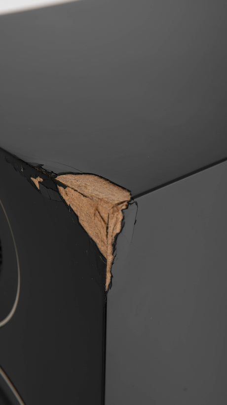 Close up of a used PMC Prodigy5 Floorstanding Speaker in a Black finish showing crack on front right corner