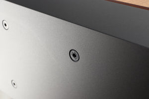 Close up of a used PMC ProphecyC Centre Speaker in a walnut finish showing a light scratch on right side