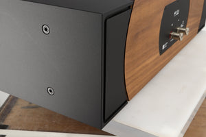 Rear right corner of a used PMC ProphecyC Centre Speaker in a walnut finish