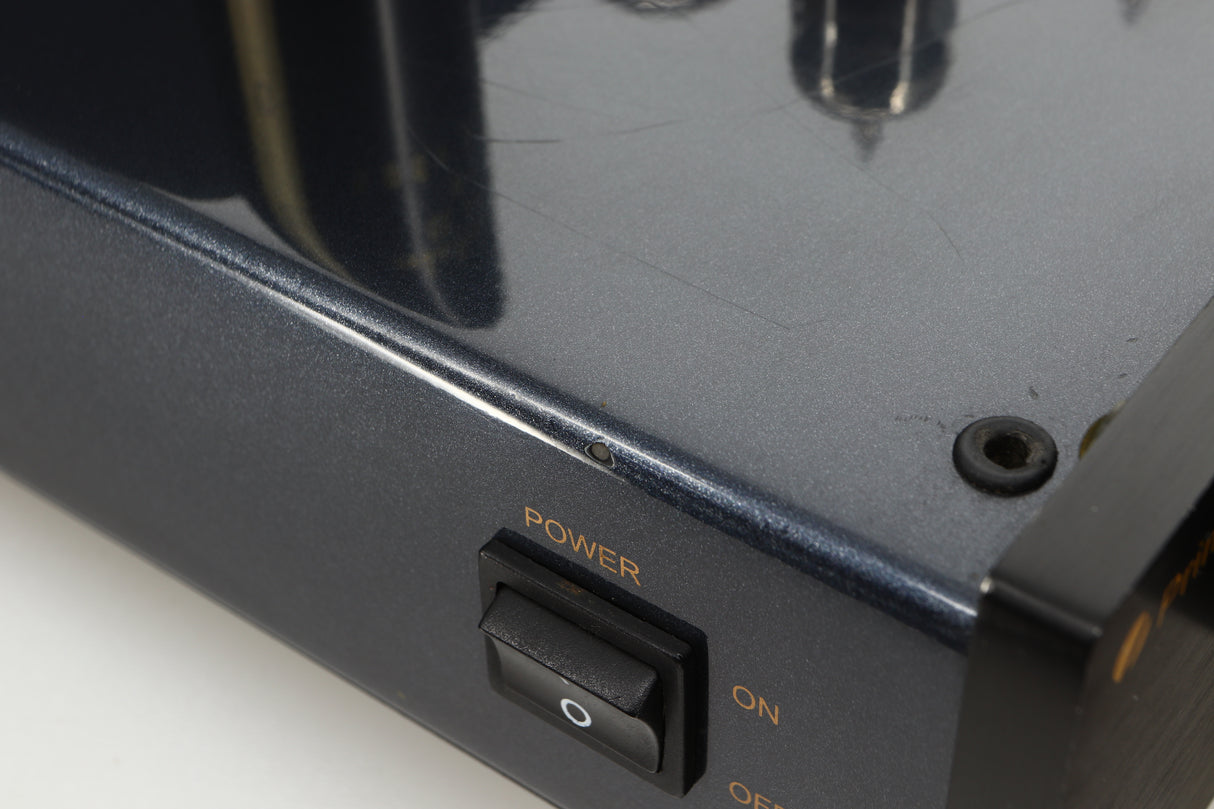 Close up view of a used PrimaLuna Prologue Premium Pre Amplifier in Black finish showing a chip to the finish on the left side