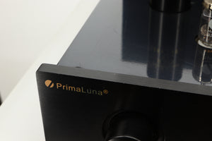 Close up view of a used PrimaLuna Prologue Premium Pre Amplifier in Black finish showing some small scratches to the front edge
