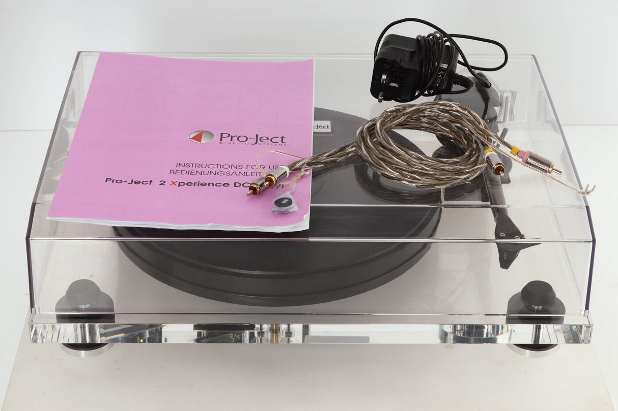 Front view of a used Pro-Ject 2 Xperience DC Acryl Turntable with Ortofon 2M Black Cartridge with manual, mains cable, and interconnects