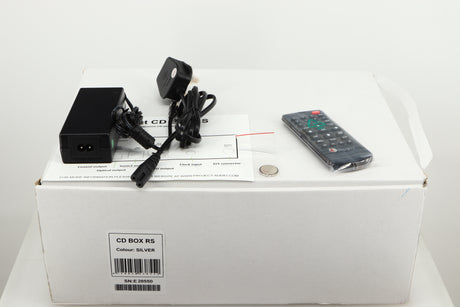 Box for a used Pro-Ject CD Box RS CD Transport in a silver finish showing Remote, Battery, Manual and PSU