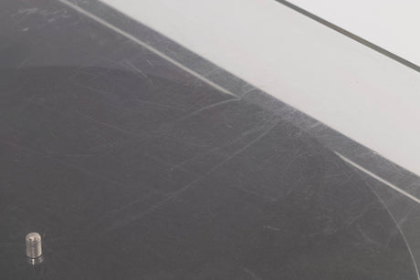 Close up of a used Pro-ject P2 Turntable / Goldring 2 Cartridge in a Black finish showing scratching on top of lid