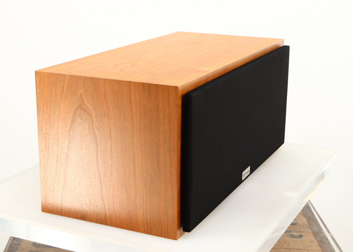 Front left corner of a used ProAc Centre Voice Speaker in a cherry finish