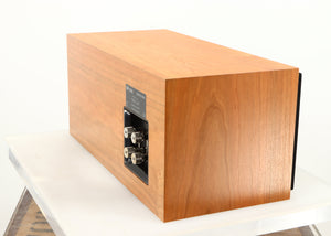 Rear left corner of a used ProAc Centre Voice Speaker in a cherry finish