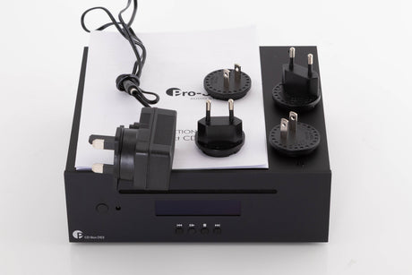 Top of a used Project CD Box DS3 CD Player in a Black finish showing PSU, Manual and Schuko Plugs