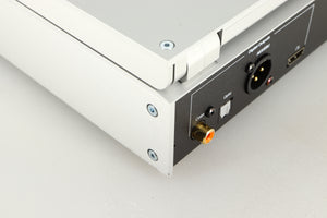 Close up of a used Project CD Box RS2 T CD Transport in a silver finish showing scratching on rear right corner